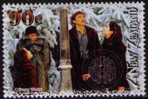 Lucy, Edmund, Peter and Susan in snowy forest