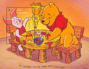 Winnie the Pooh and Piglet decorating biscuits